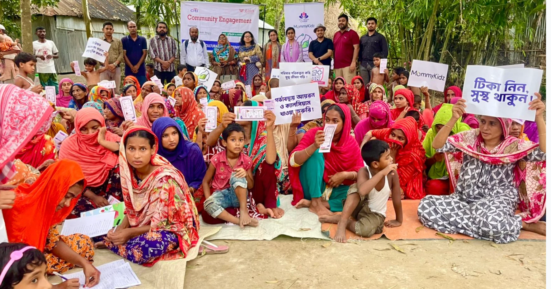 Community members and programme team together at an outdoor gathering
