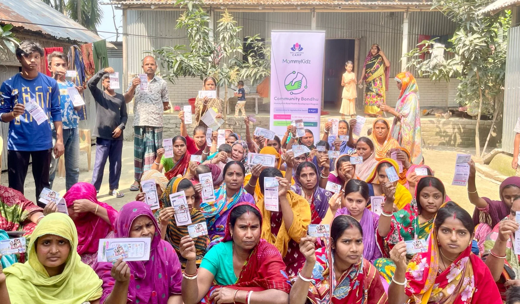 Community Bondhu participants gathered with programme leaflets